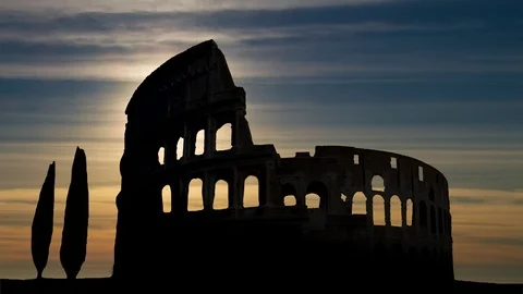 Time Lapse at Sunset with Iconic Monument Colosseum in Silhouette Stock Footage 100689926