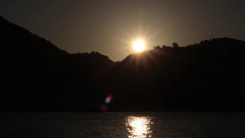 Time lapse of sunset on lake Como, Italy with boats passing by and reflections Stock Footage 118757149