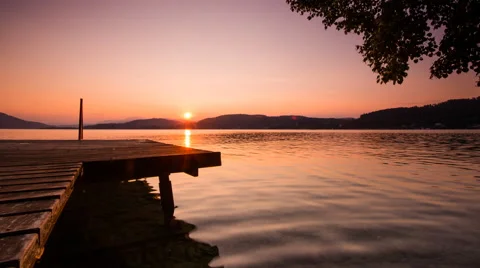 Time Lapse - Sunset at the lake with a jetty Stock Footage 58653389