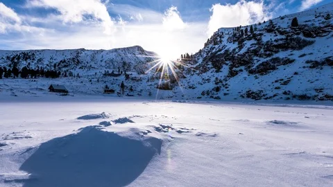 Time Lapse - Sunset with last sunligt in a landscape covered with fresh snow Stock Footage 99359509