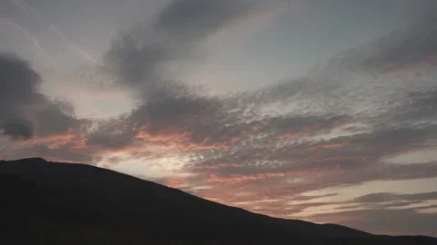 Time lapse at sunset, from light orange-blue sky to dark. Stock Footage 220650420