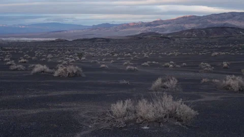 Time lapse of sunset light rays on volcanic hills and mountains in Death Valley Stock Footage 147516089