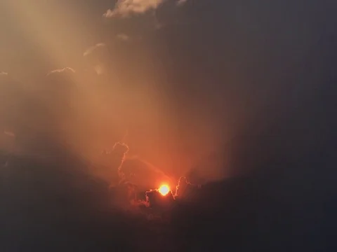 Time Lapse Sunset in the middle of a beautiful orange light cloud. Stock Footage 74767897