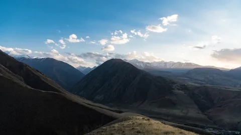 Time lapse of sunset in the mountains. God rays shining through clouds. Stock Footage 292524435