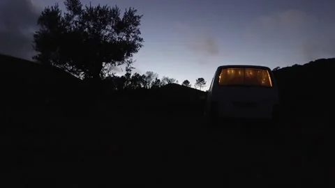 Time lapse from sunset to nightfall. A van in the middle of nowhere. Stock Footage 141933867