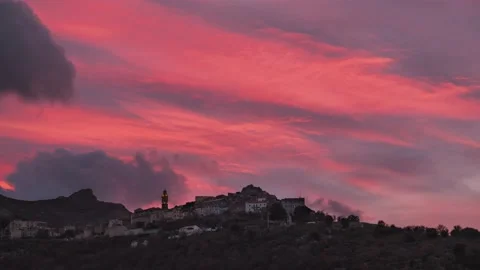 Time-lapse of sunset over the ancient mountain village of Speloncato in Corsica Stock Footage 147535110