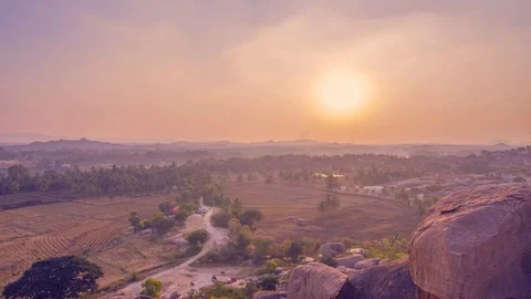 Time lapse of the sunset over a busy Indian village Stock Footage 85953882