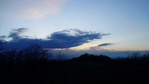 Time lapse of sunset over a castle with dramatic clouds Stock Footage 74171305