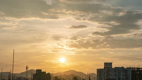 Time lapse of sunset over city hills and buildings Stock Footage 168899072