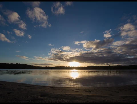 Time lapse of sunset over a coastline in New Southville, Australia Stock Footage 134817637
