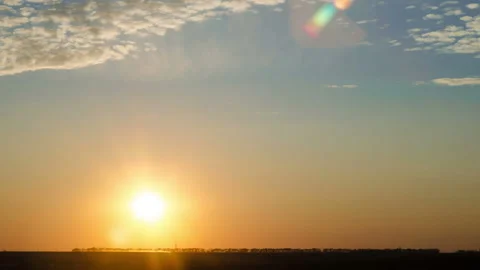 Time lapse of sunset over flat landscape Stock Footage 137428065