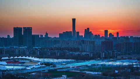 Time-lapse of the sunset over Guomao with Chaoyang Sports Center in the backgrou Stock Footage 300119862