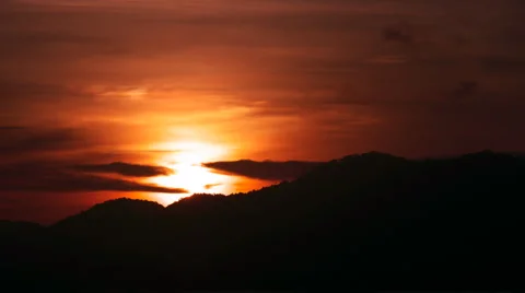 Time Lapse Sunset Over Hillside with moving clouds Stock Footage 56938033