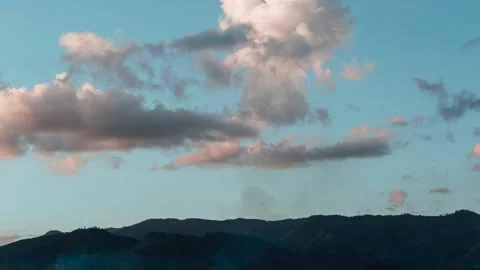 Time-lapse of sunset over jungle mountain with clouds and smoke (4K, 30 fps) Stock Footage 249543114