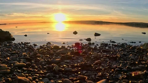 Time-lapse of Sunset over a Lake with Distant Mountains Stock Footage 283930544