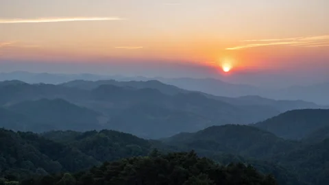 Time lapse of sunset over mountain ranges seen from Doi Khum Far in Chiang Mai Stock Footage 265393222