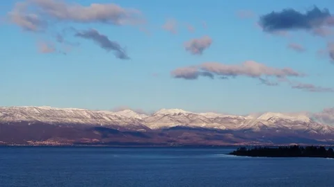 Time-lapse of sunset over mountains by Ohrid Lake, Macedonia Stock Footage 85039278