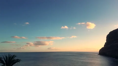 Time Lapse. Sunset Over Ocean With Palm Tree Silhouettes and Sunburst. Stock Footage 327544883