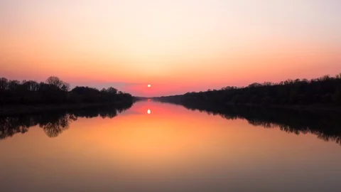 Time Lapse sunset over the river. Nature skyline at Golden Hour hyper lapse 5k Stock Footage 127715462