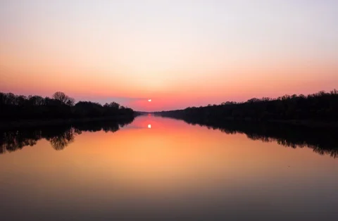 Time Lapse - Sunset over the River in the Jungle. 5.5k Stock Footage 128984910