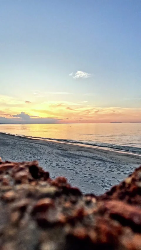 Time lapse sunset over the sea, the clouds move into the color-changing sky Stock Footage 334863543