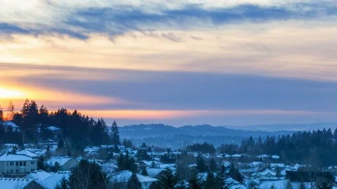 Time lapse of sunset over snow covered residential homes in Happy Valley OR 4k Video stock 72396421