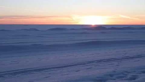 Time lapse of sunset over snowy frozen gulf of sea Stock Footage 122122189