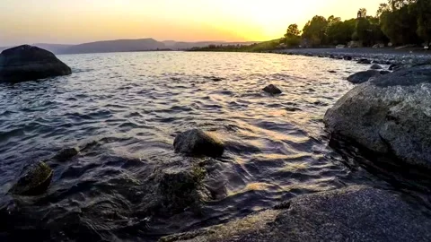 Time-lapse of sunset over St Peters Beach, Sea of Galilee Israel 스톡 동영상 153891836