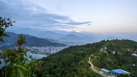Time lapse of sunset over town with Himalayan Mountains in the background Video stock 91134639