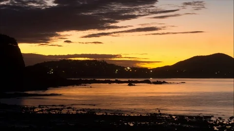 Time lapse of sunset over water Stock Footage 108424552