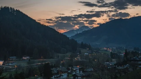 Time Lapse of sunset overlooking mountains in Kitzbühel in Austria Stock Footage 96453078