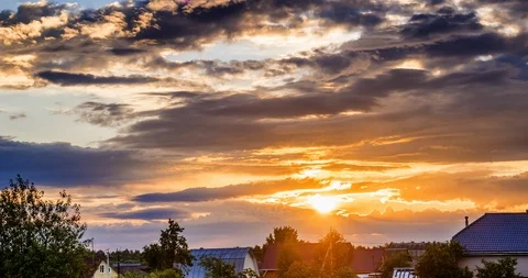The time-lapse sunset, passing clouds above the village Video stock 86450002