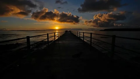 Time lapse of sunset at the pier in Burwick in Orkney in 4k Stock Footage 293207822