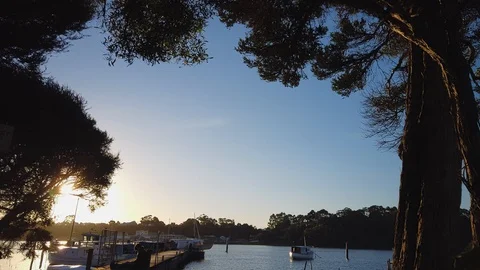 Time-lapse of sunset at pier in Strahan Tasmania Stock Footage 106929360