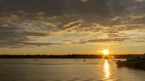 Time lapse. Sunset on the river. 4K. 30 fps Stock Footage 140618006