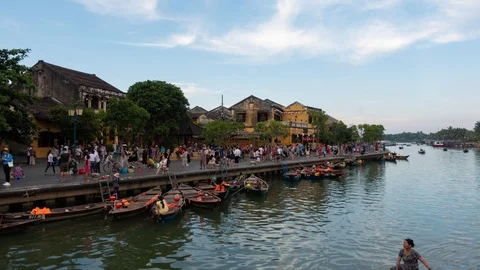 Time-lapse of sunset river view with floating lanterns and boats in Hoi An Stock Footage 94786475