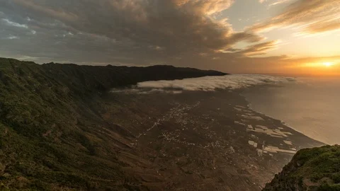 Time lapse sunset with sea of clouds over the Valley of El Golfo, El Hierro Stock Footage 115548554