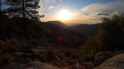 Time Lapse of Sunset setting over cloud covered mountains in Idyllwild Stock Footage 142768501