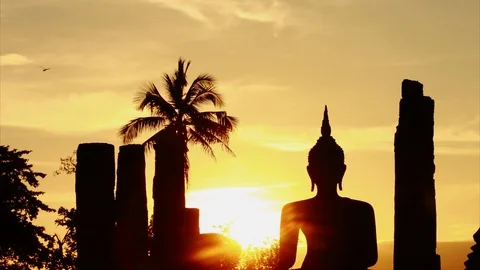 Time Lapse Sunset Silhouette buddha image Wat Mahathat Sukhothai temple Thailand Stock Footage 105529116