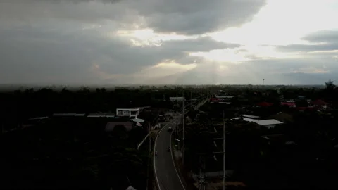 Time lapse of sunset sky against the shadows of the mountains and rural villages Stock Footage 220168989