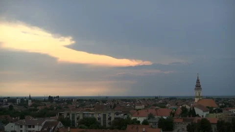 Time lapse of sunset sky over small city Stock Footage 93273432
