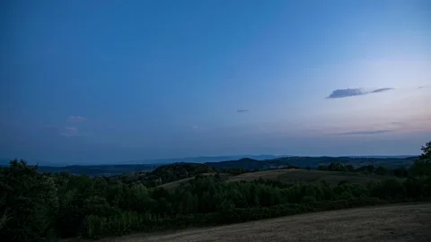 Time-lapse of Sunset to Starry Night over Forest and Villages from Hilltop Видео 288689262