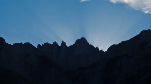 Time Lapse of Sunset Sun Beams in Blue sky behind Mount Whitney in California Stock Footage 56474339