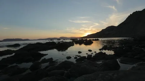 Time lapse of a sunset, sun goes down behind the mountain. Stock Footage 199663274