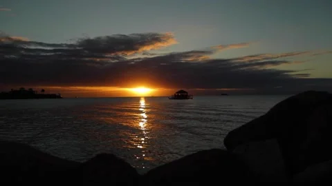 Time lapse of sunset, sun going down from big cloud, dark sky from light to dark Stock Footage 202118234