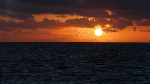 Time lapse of sunset, sun locked in one place, very vivid strong crimson colors Stock Footage 204926071