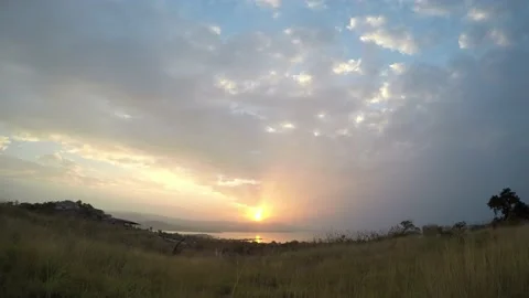 Time lapse of sunset with sun rays on clouds behind the mountains, Thailand Stock Footage 155058121