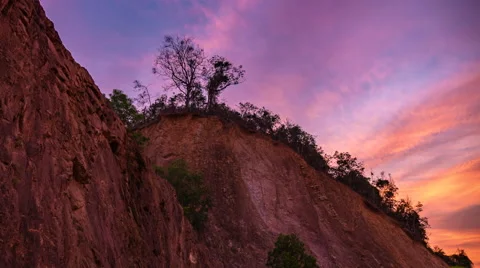 Time Lapse Sunset Twilight Against Cliff Video stock 61440938