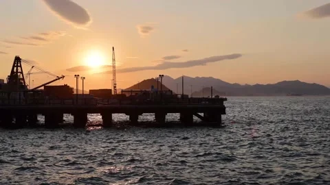Time lapse of sunset view of piers in Victoria Harbour near Central Western D Stock Footage 169785351