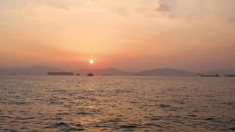 Time lapse of sunset view, Victoria Harbour, Hong Kong. boats coming and goin Stock Footage 153085280